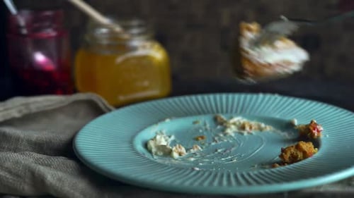 Fork Taking Bites of Cake Slice on Plate