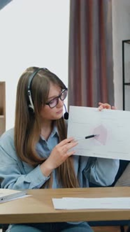 Woman Presenting Data in Online Corporate Meeting