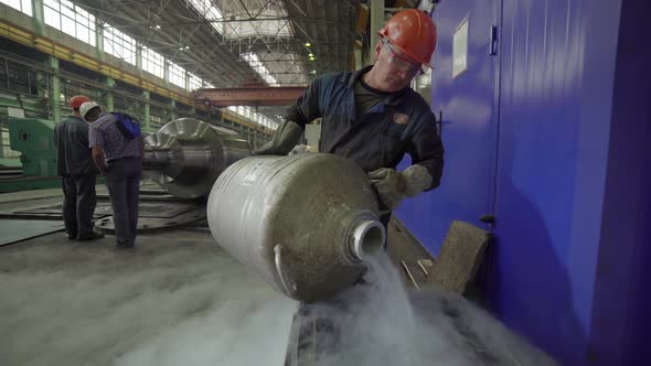 An Industrial Worker Skillfully Handling Cryogenic Equipment Used in ...