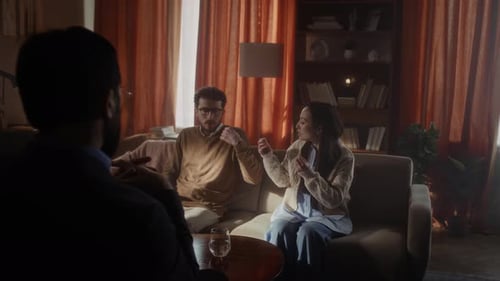 Couple Talking During Counseling Session in Living Room