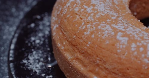 Powdered Sugar Cake Close Up on Plate