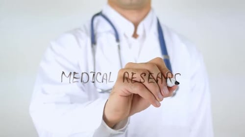 Doctor Writes Medical Research On Clear Screen