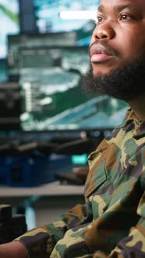 Vertical Video Officer Doing Tasks in Military Base Analyzing Moves