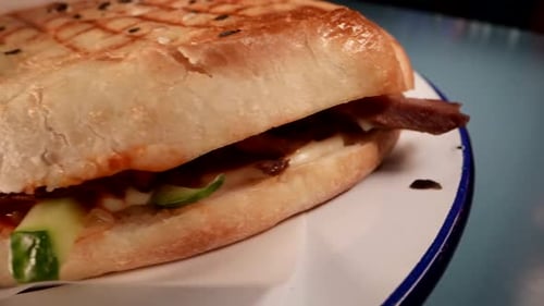 Tasty Hamburger with Meat and Vegetables in Restaurant Closeup View of Kitchen Table