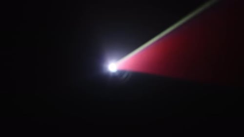 Yellow And Orange Light Beams From Projector