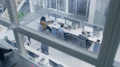 Camera Moving From Open Space Office People Working at their Desktop Computers to Businesswoman Usi