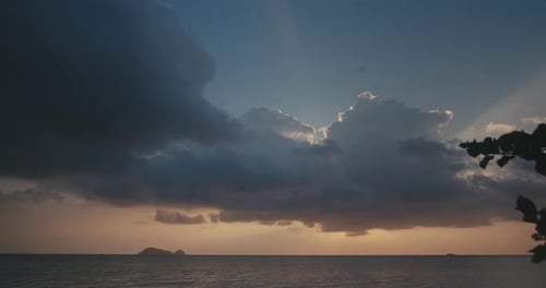 Cloudscape time lapse Seascape sunset with sun flares behind clouds