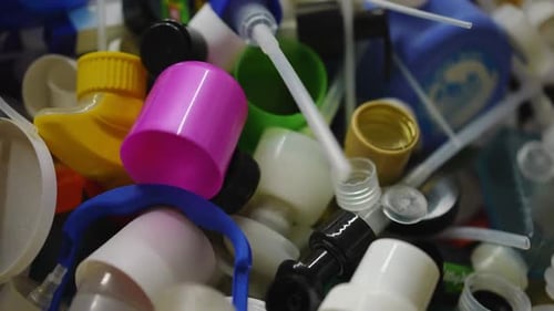 Multicolored Plastic Garbage in Box Closeup Closeup High Angle View Colorful Bottle Caps and