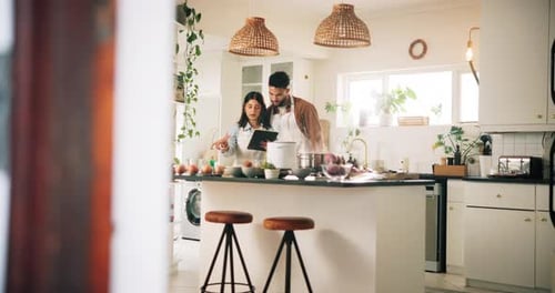 Couple Cooking Together in a Modern Kitchen