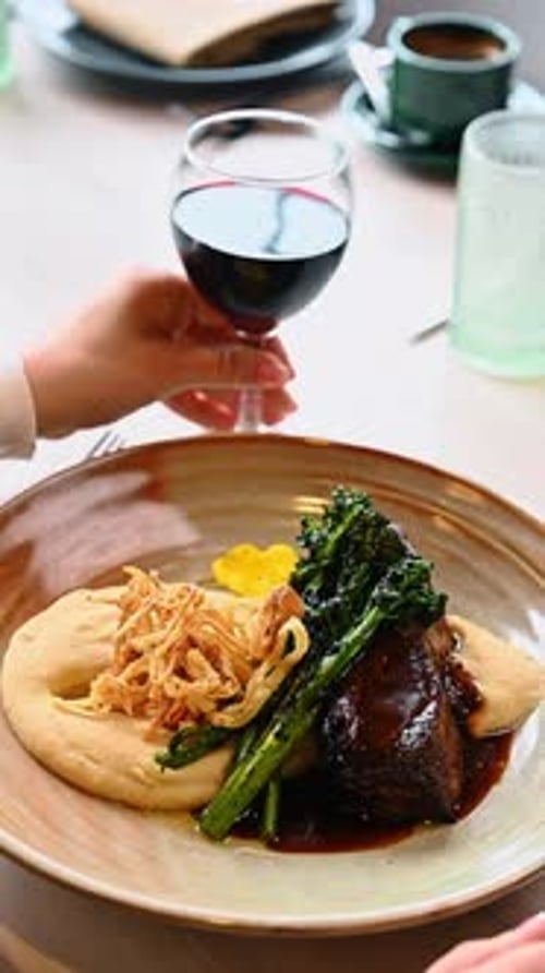 Elegant plated steak dish in a restaurant setting
