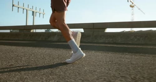 Running, fitness and legs of person in city for workout, marathon training and exercise