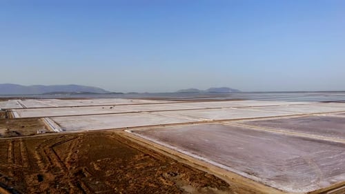View of a Salt Flat Factory Besides the Sea Drone Shot of Salt Extraction