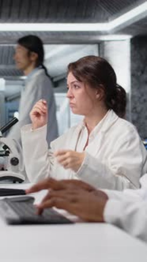 Woman Scientist Taking Notes in a Laboratory Setting