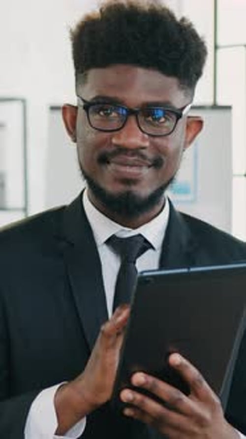 Handsome Smiling Experienced 30Aged Stylish Bearded Blackskinned Office Manager in Formal Wear in