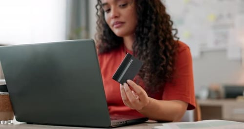 Woman Uses Laptop and Credit Card at Home