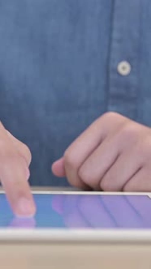 Using Tablet on Desk, vertical video