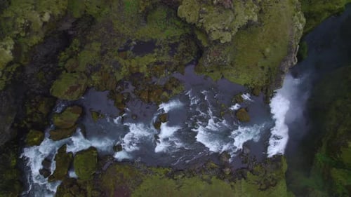 Aerial overhead view of the famous natural landmark and tourist attraction of Skogafoss falls in Ice