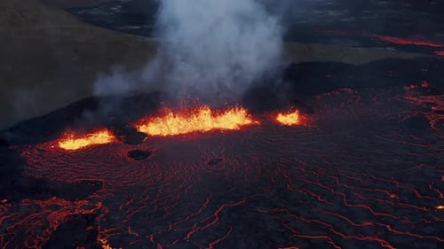 New Fagradalsfjall fissure volcano erupting with molten lava, Meradalir valley, night time