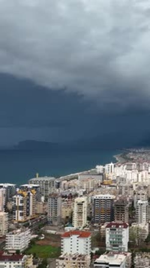 Vertical Video Coastal Warning Aerial View of Stormy Mediterranean Coastline and City Panorama