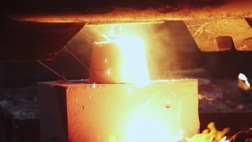 Pouring Molten Metal with Sparks and Flames