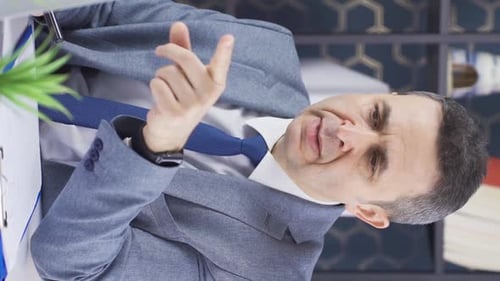 Man Explaining Business Documents in Office Workplace