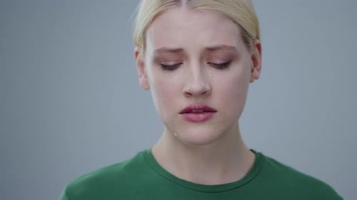 Tearful Woman with Blonde Hair Crying