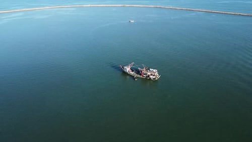 Fishing boats lean on the Aceh lampulo pier