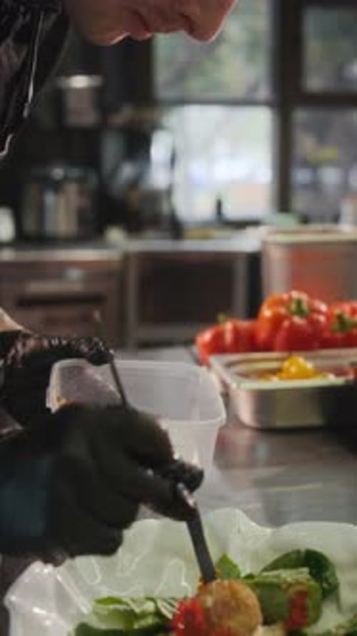 Chef Plates Appetizing Salad with Unique Toppings