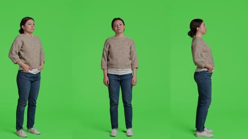 Woman Holds Mask on Chroma Green Screen