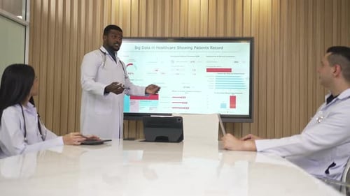 Medical Team Analyzing Data in Modern Conference Room