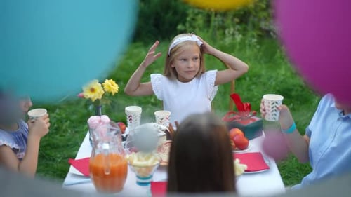 Children Celebrate Birthday Party Together in Garden