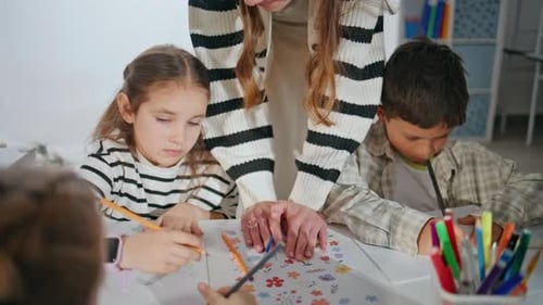 Focused Schoolchildren Art Lesson at School Closeup Woman Teacher Helping Kids