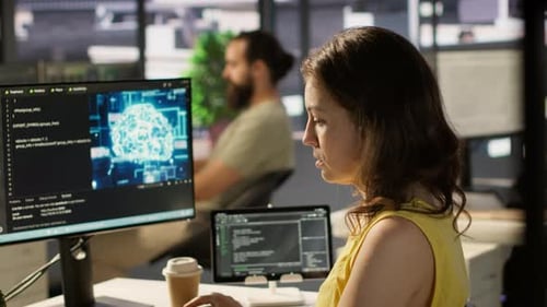 System Administrator at Work Doing Debugging of AI Software Using PC