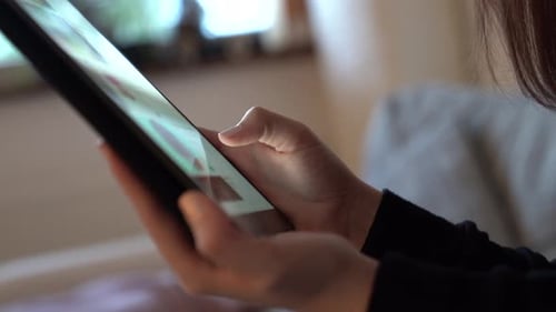Woman Using Tablet Indoors, Close Up