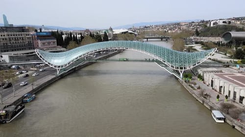 Aerial shot of peace bridge Georgia Tbilisi city center