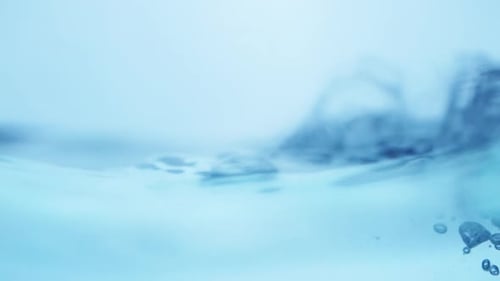 Water waves on surface with blue background_slow motion