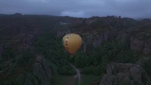 Aerial view of hot air balloon over rock formations, Bulgaria.