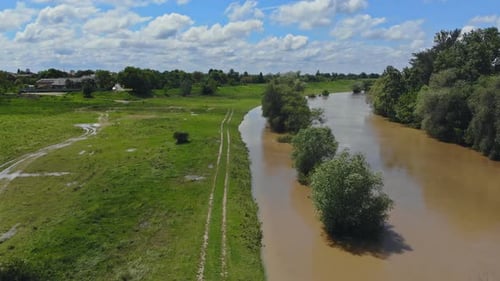 As a Result of Heavy Rain Water Flowing on a Field Caused Damage to the Field
