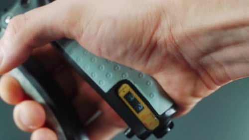 A close up shot of a man hand squeezing a arm clamp trainer, 4K video, fitness sport