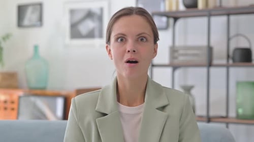 Wondering Young Businesswoman in Creative Office