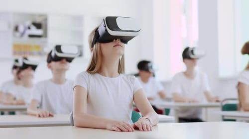 Children Wearing VR Headsets in Classroom
