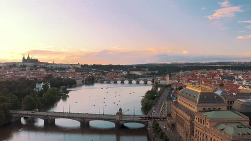 Aerial drone view of Prague sunset over Vltava river and Prague castle, St vitus cathedral in the ba