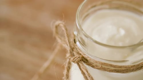 Food and Dairy Products Concept - Close Up of Homemade Yogurt Or