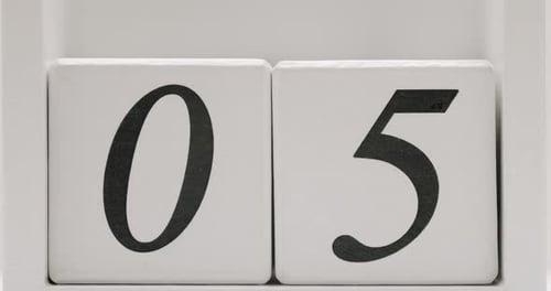 CloseUp Of Wooden Blocks Displaying Number 05 On White Background