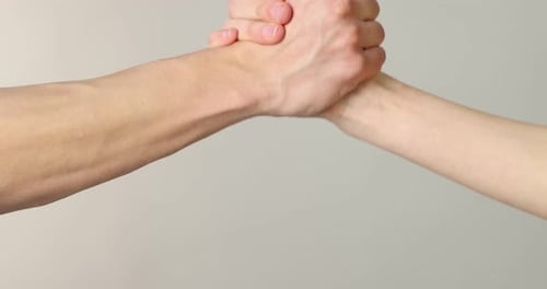 Hands of a Man and Woman Grasping