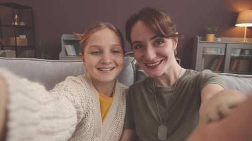 Smiling Woman and Girl Posing Together