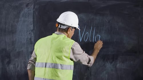 Engineer Writes Voltage on Blackboard