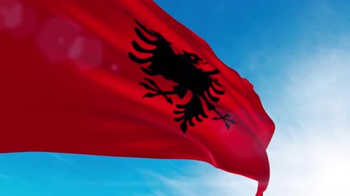 Albania Flag Waving in Slow Motion Against Blue Sky
