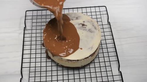 Pouring Chocolate Glaze Over Homemade Cake