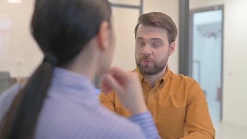 Close up of Businessman Talking with Teammates